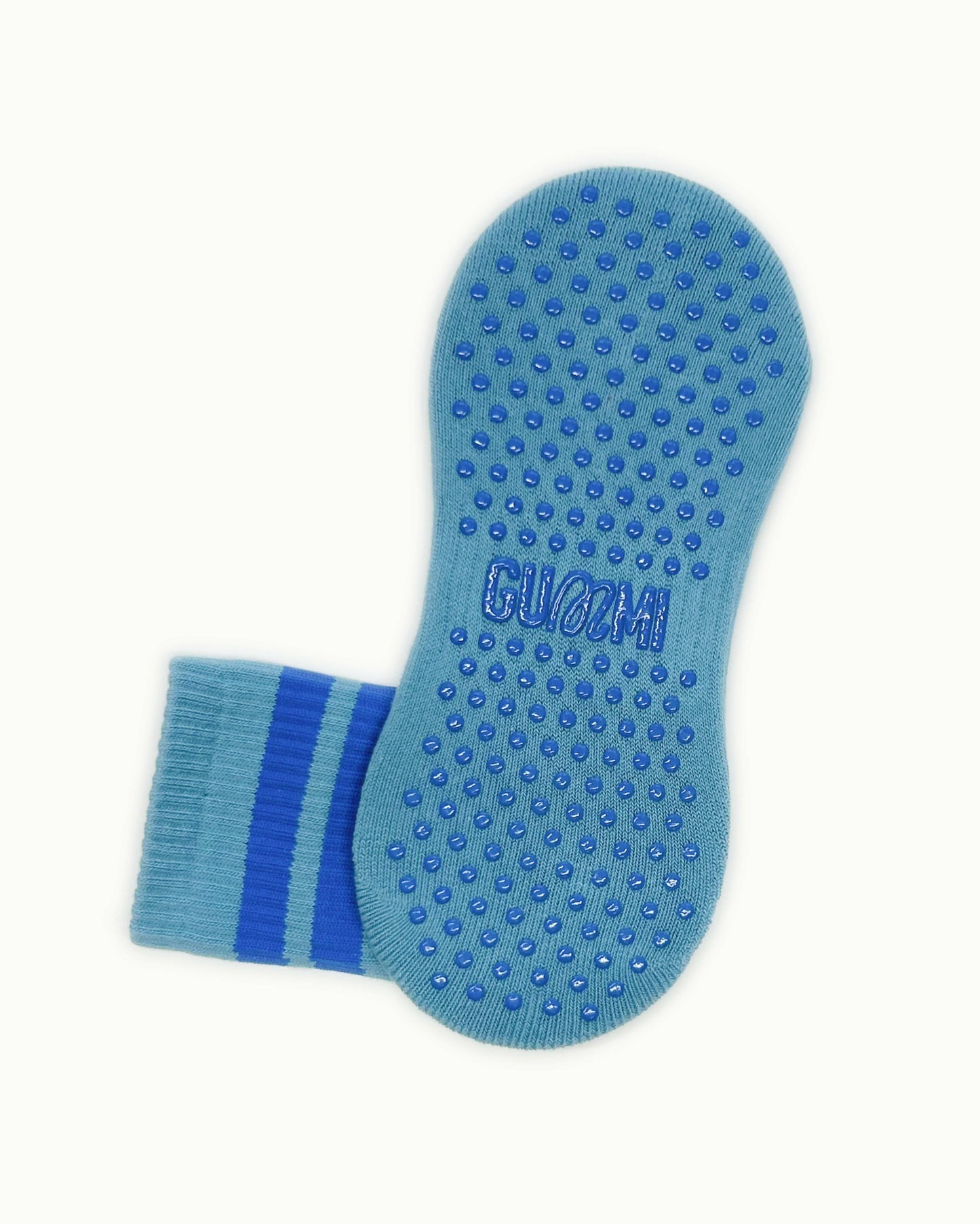 Non-slip sole of blue GUMMI grip socks for Pilates, reformer, yoga and barre.