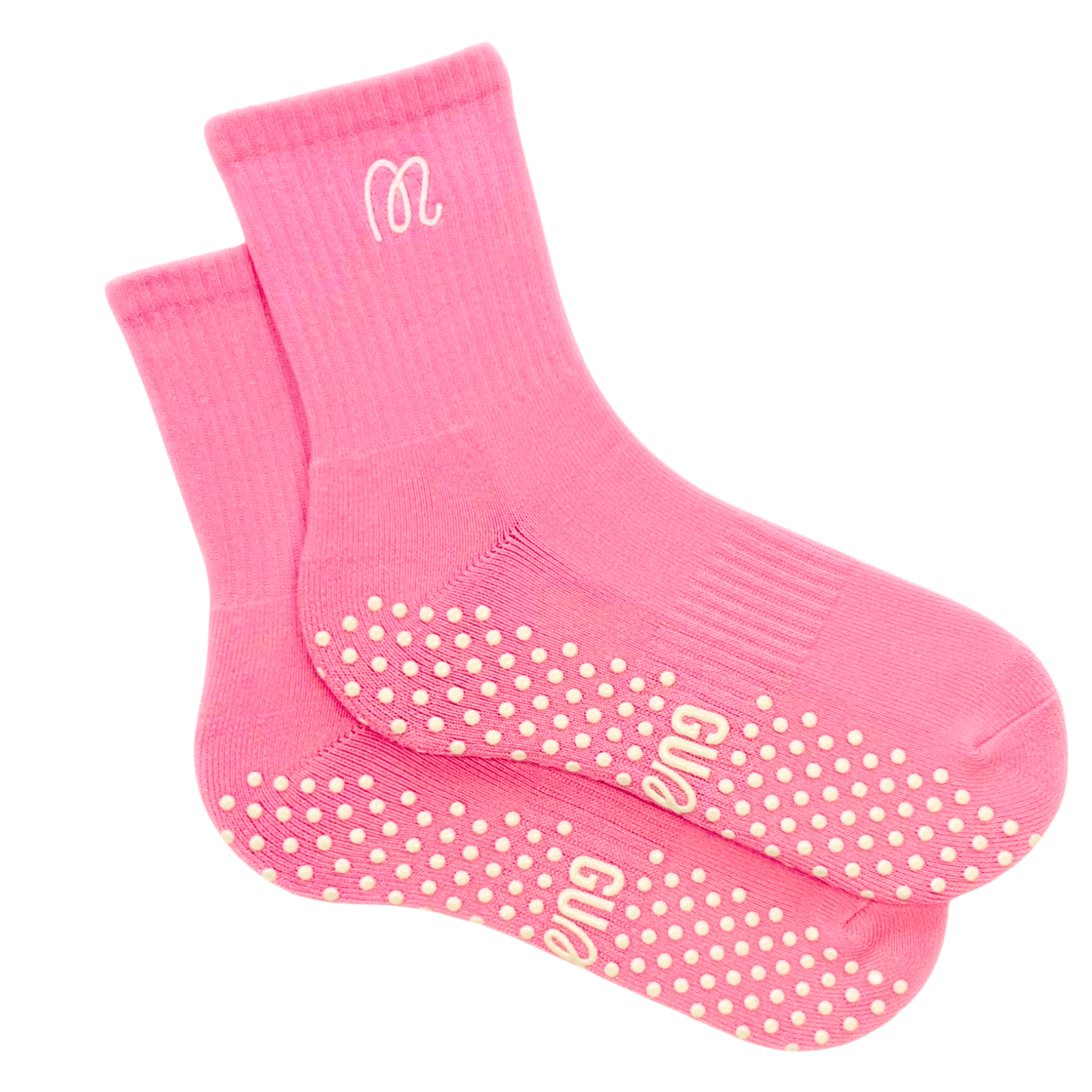 Pink socks with grip dots on a white background