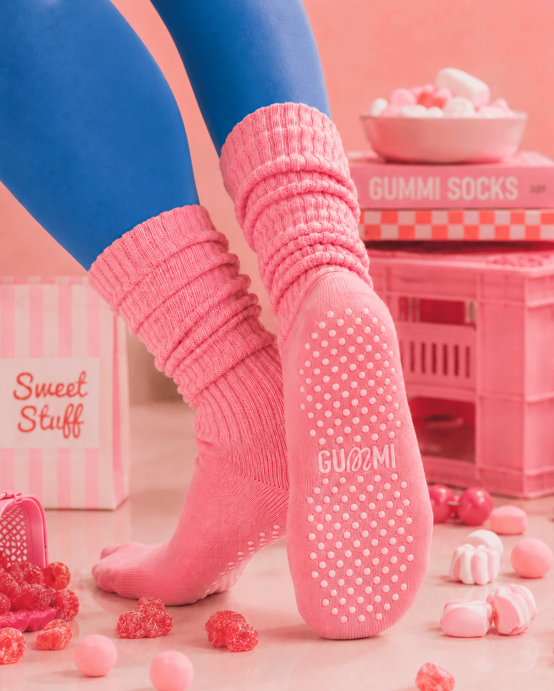 Pink GUMMI socks in a pink candy themed backdrop