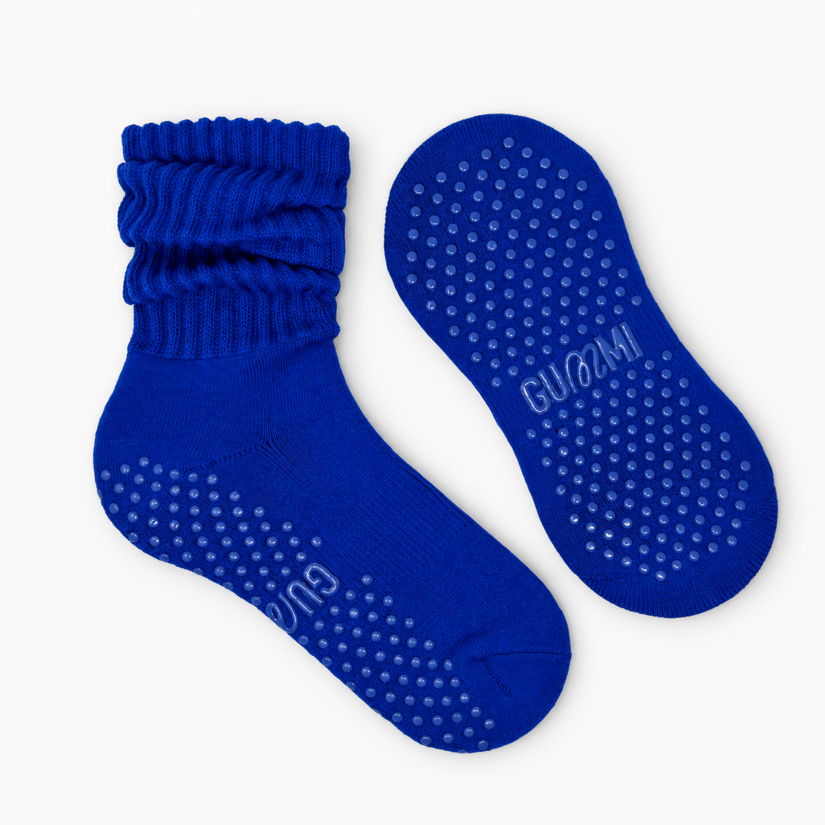 Moonlight Melt cobalt blue slouchy Pilates grip socks with scrunched ribbed cuffs and matching blue silicone non-slip grip dots on the soles