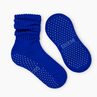 Moonlight Melt cobalt blue slouchy Pilates grip socks with scrunched ribbed cuffs and matching blue silicone non-slip grip dots on the soles