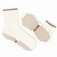 Butter Mint cream crew length Pilates grip socks with warm brown trim and non-slip grip dots by GUMMI SOCKS