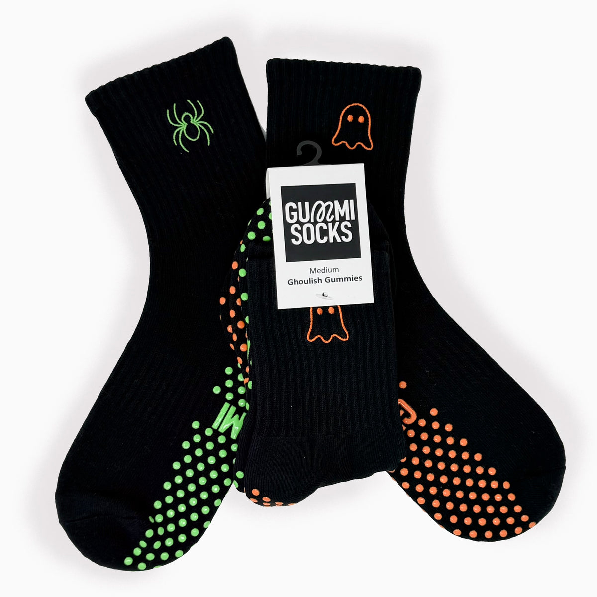 Black Halloween Reformer grip socks with mismatched ghost and spider embroidery