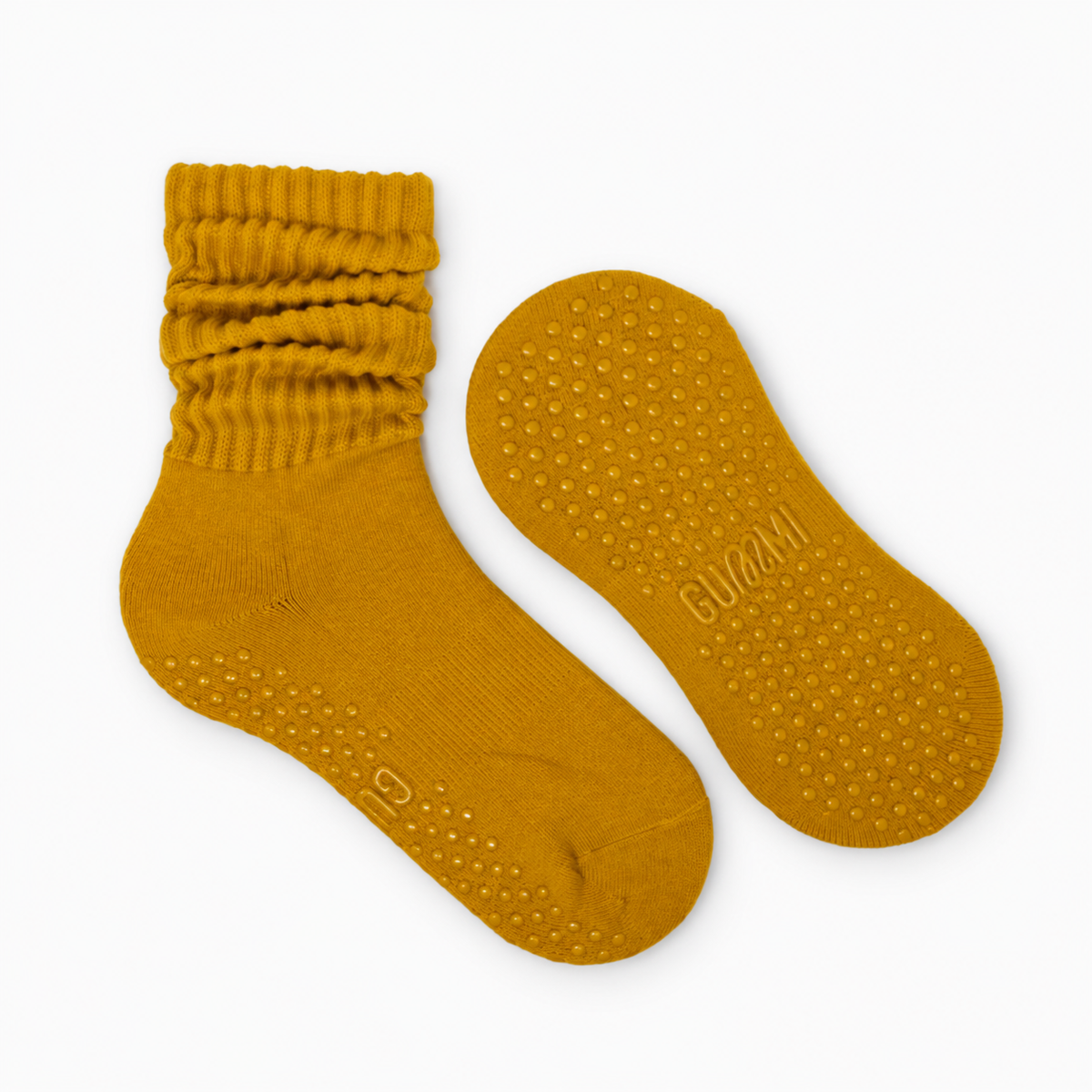 Honey Melt mustard yellow slouchy Pilates grip socks with scrunched ribbed cuffs and matching golden silicone non-slip grip dots