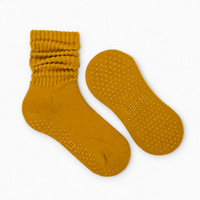 Honey Melt mustard yellow slouchy Pilates grip socks with scrunched ribbed cuffs and matching golden silicone non-slip grip dots