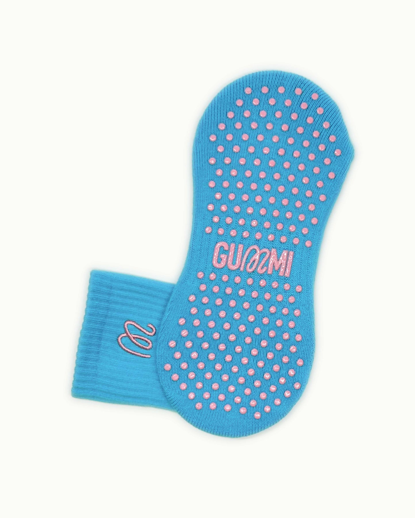 Non-slip sole of turquoise blue GUMMI grip socks for Pilates, reformer, yoga and barre.