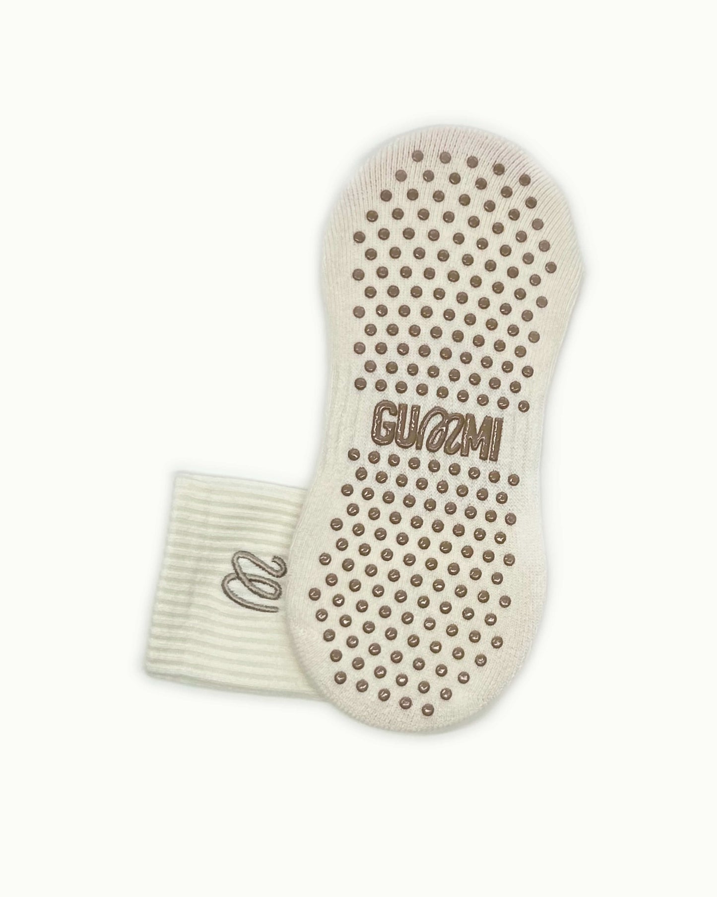 Non-slip sole of cream GUMMI grip socks for Pilates, reformer, yoga and barre.