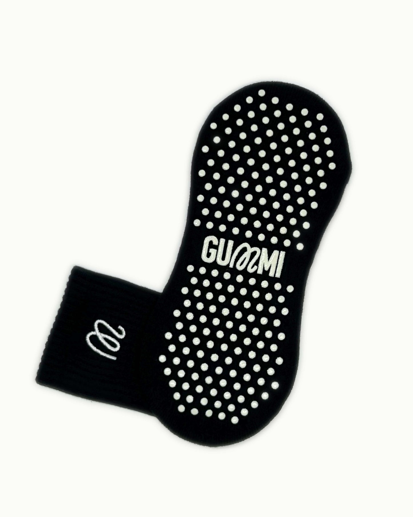 Non-slip sole of black GUMMI grip socks for Pilates, reformer, yoga and barre.