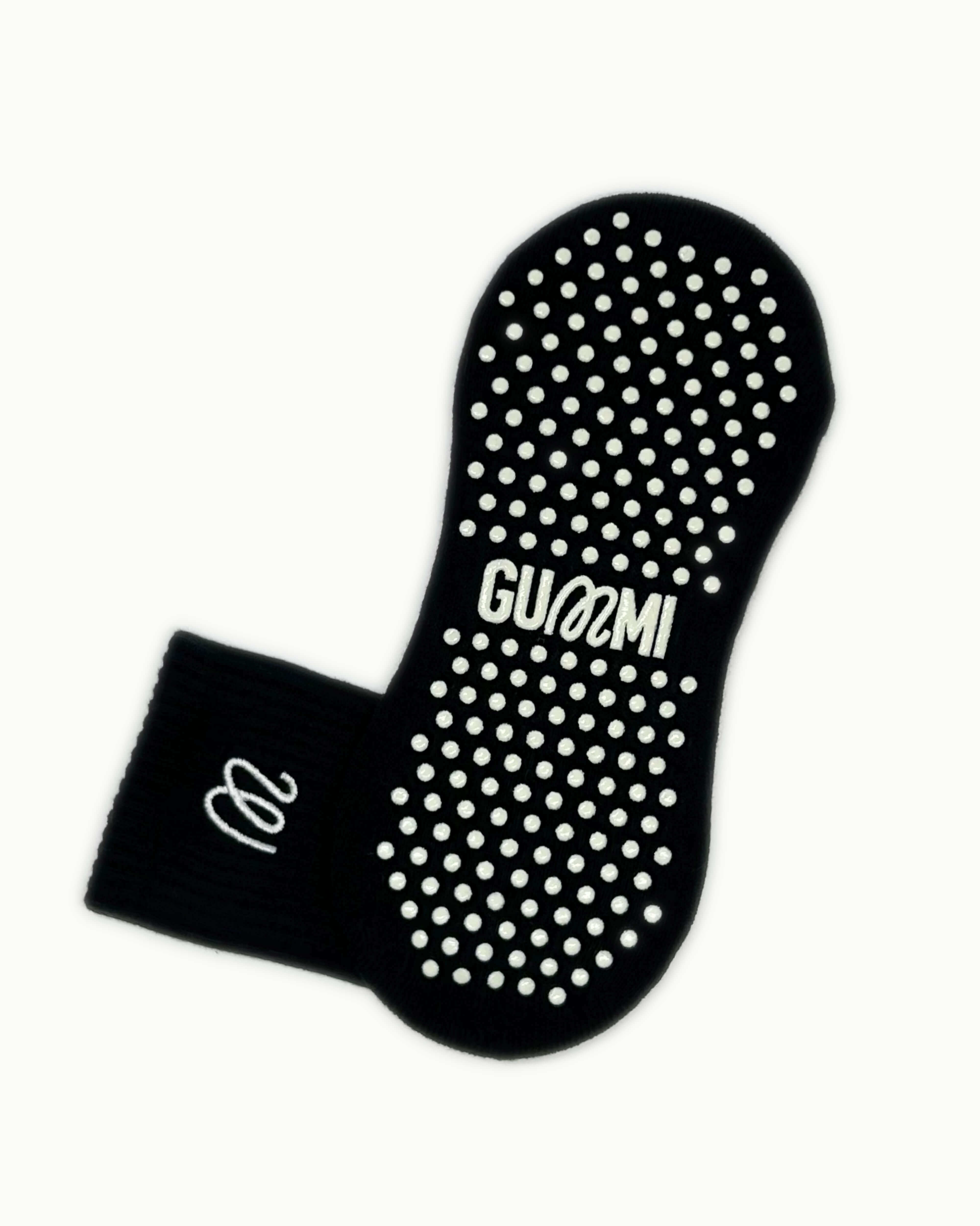 Non-slip sole of black GUMMI grip socks for Pilates, reformer, yoga and barre.