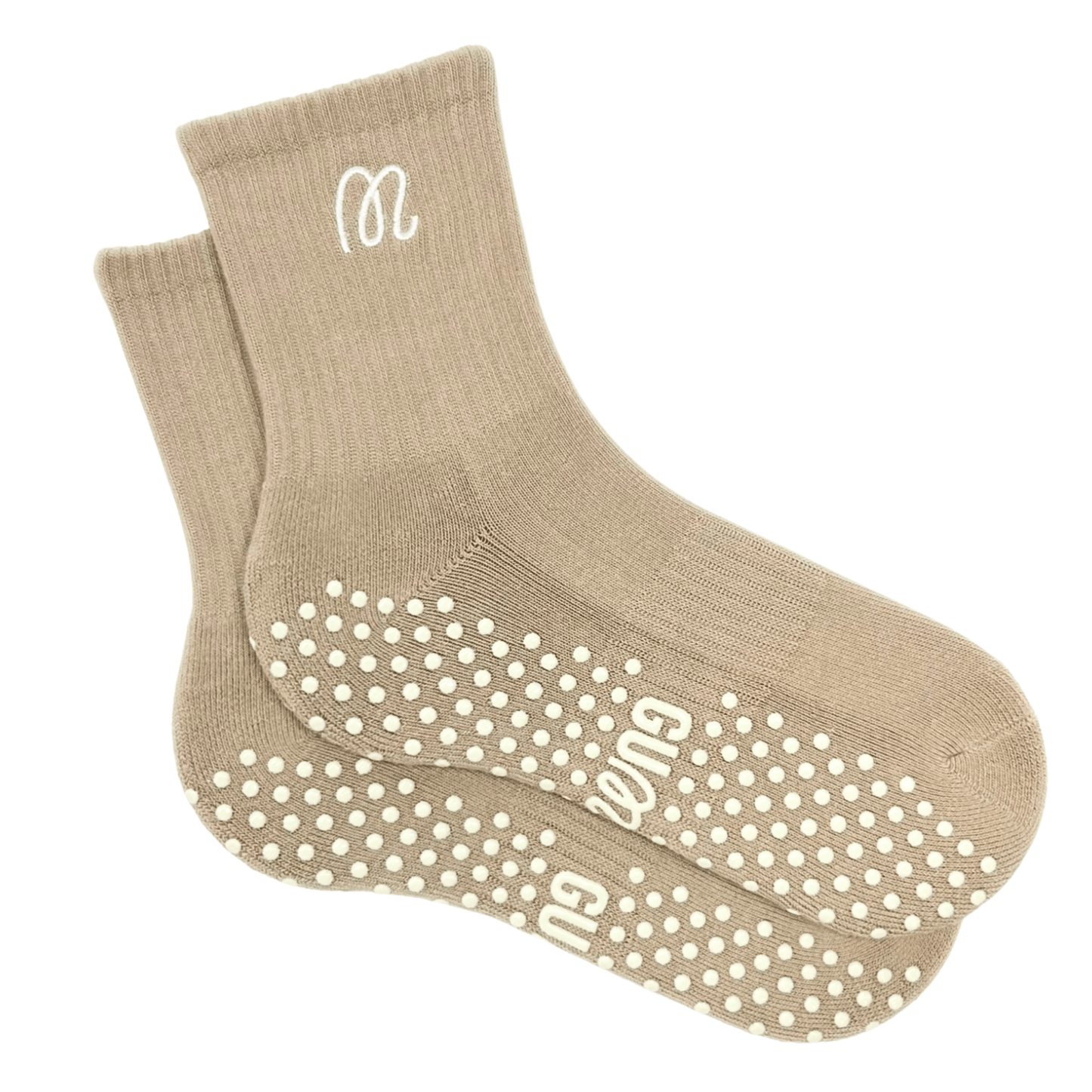 Beige socks with white grip dots and logo on a white background