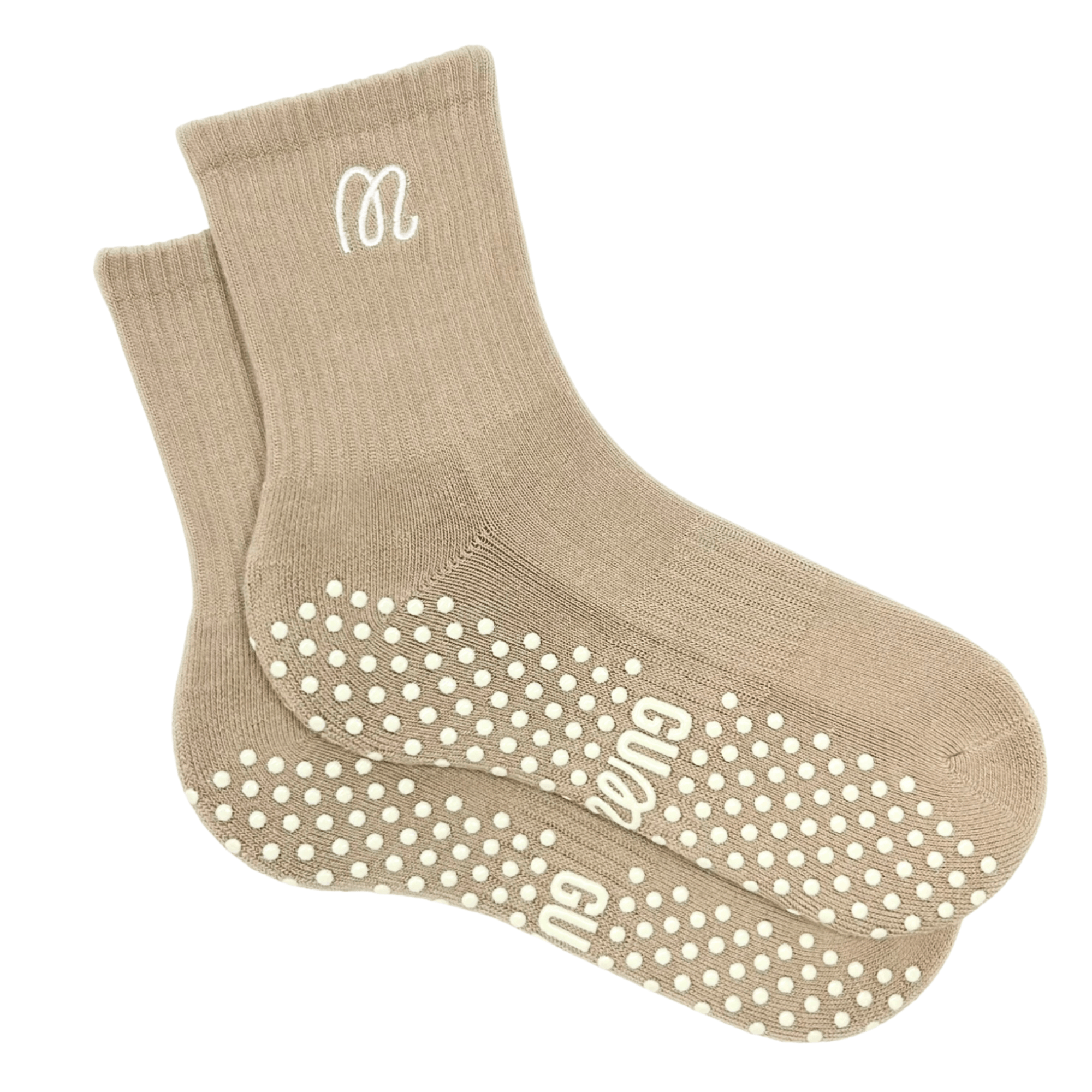 Beige socks with white grip dots and logo on a white background