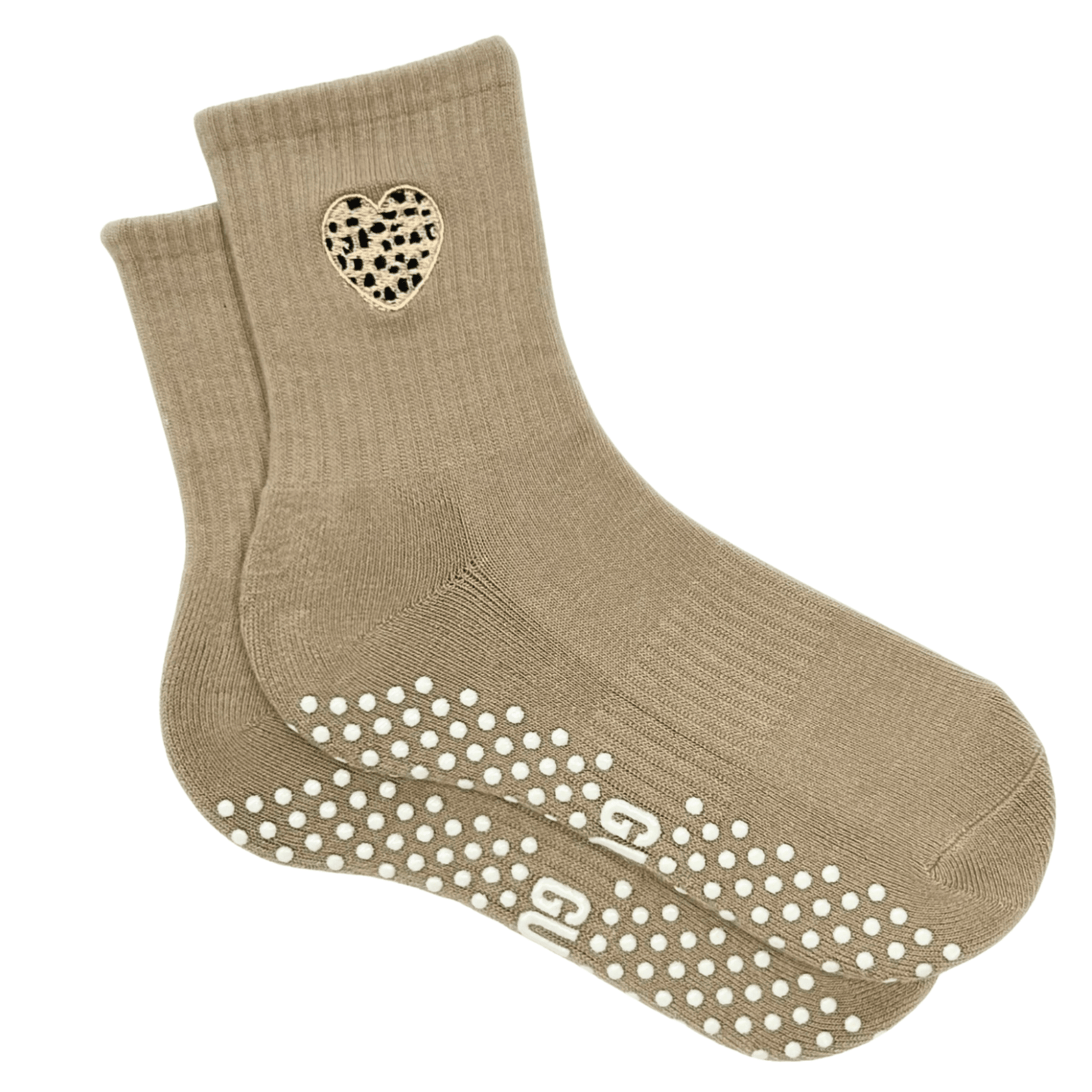 Beige socks with a heart design and grip dots on a white background