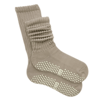 Beige GUMMI grip socks on a white background.