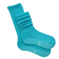 Blue socks with grip dots on a white background