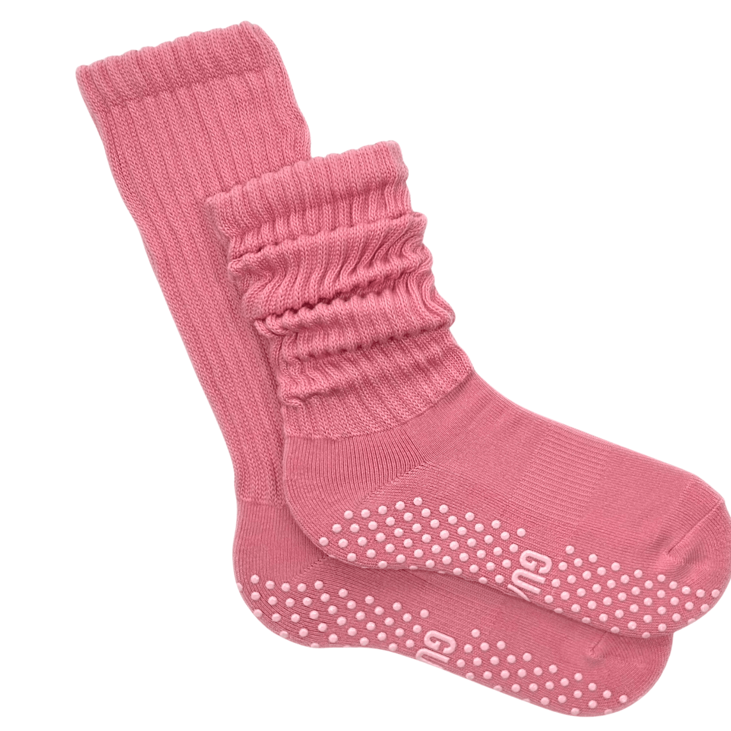 Pink grip socks with white grip dots on a white background