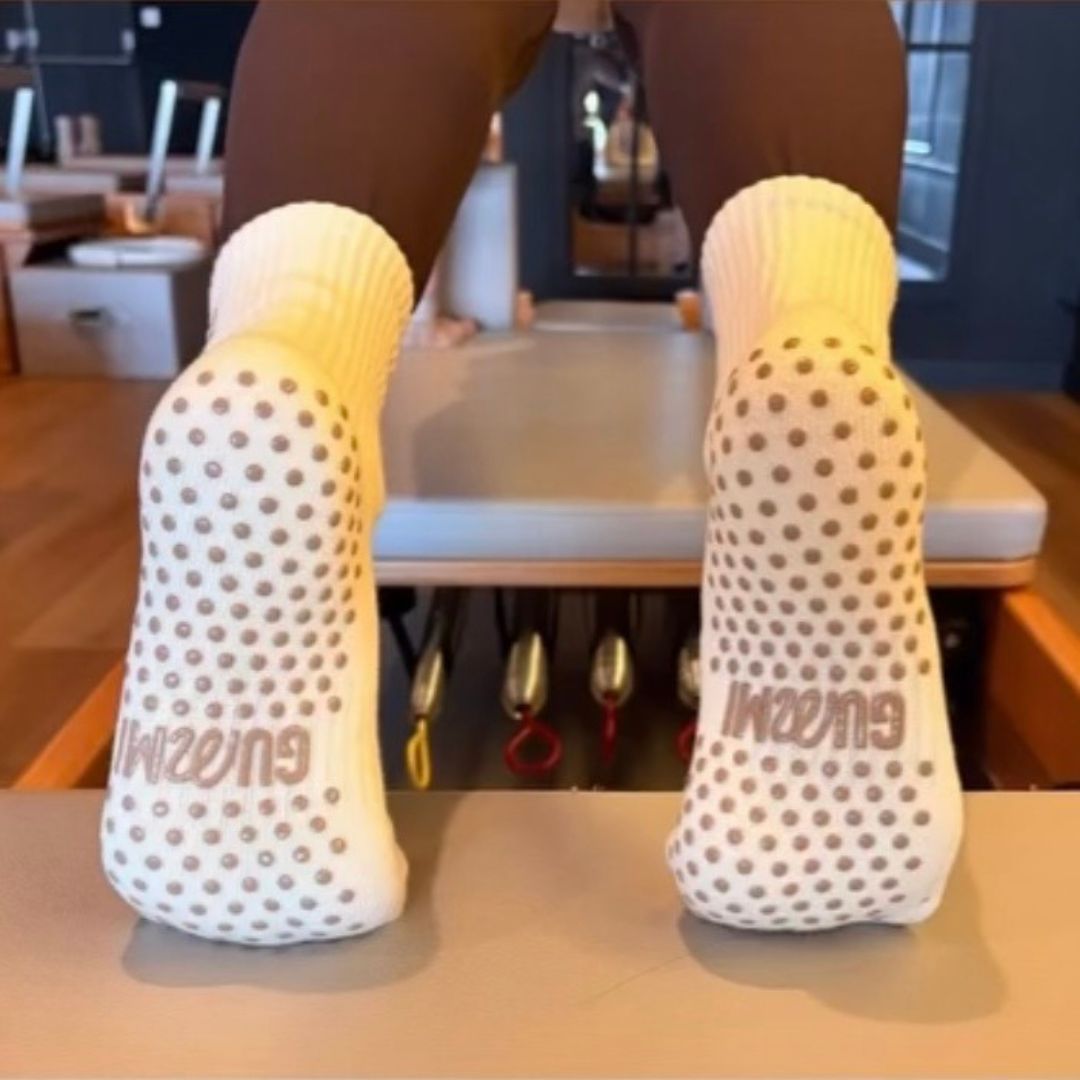 Female feet wearing cream GUMMI socks